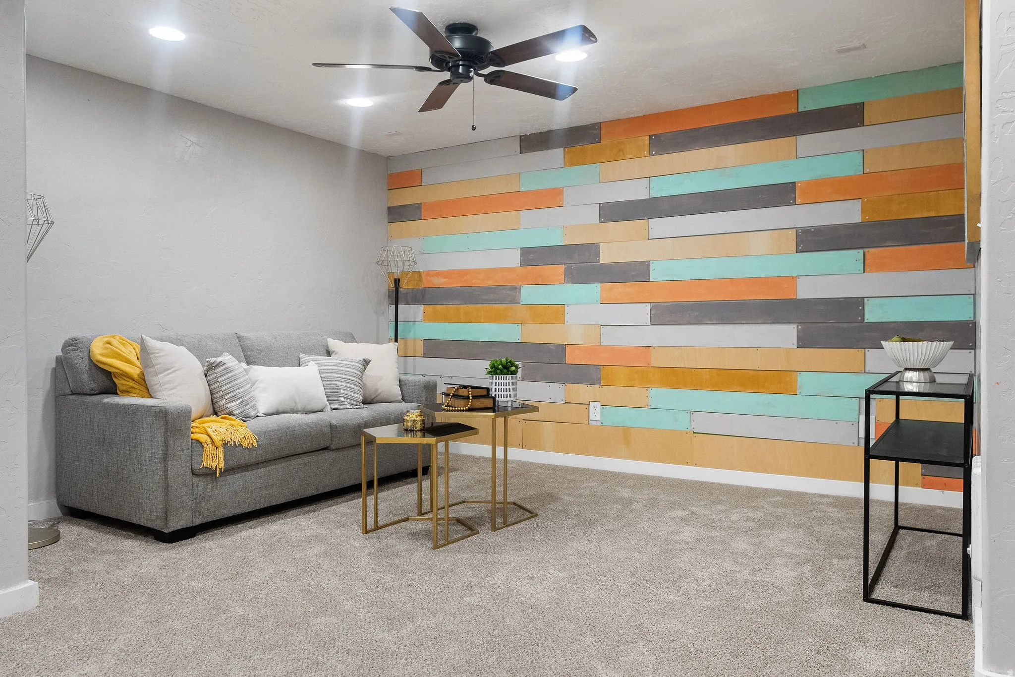 Accent wall featuring horizontal wood planks in varied colors