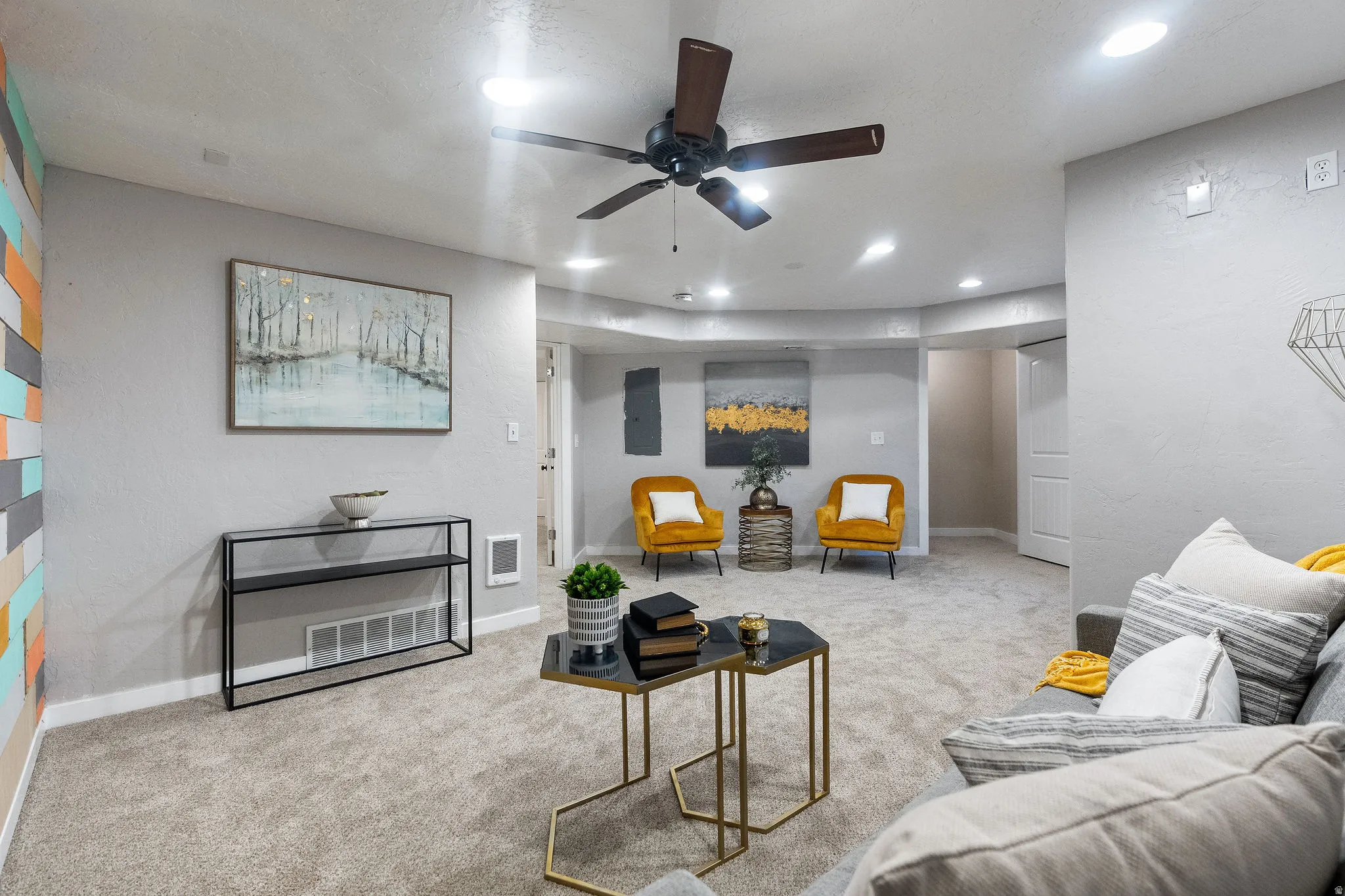 Carpeted living area featuring recessed lighting and a ceiling fan