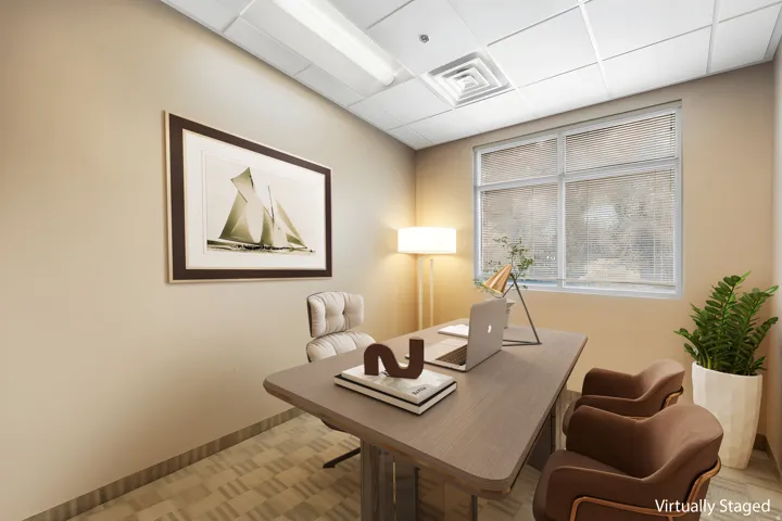 Recessed ceiling with grid, window with horizontal blinds, light-toned wall paint, patterned floor tile