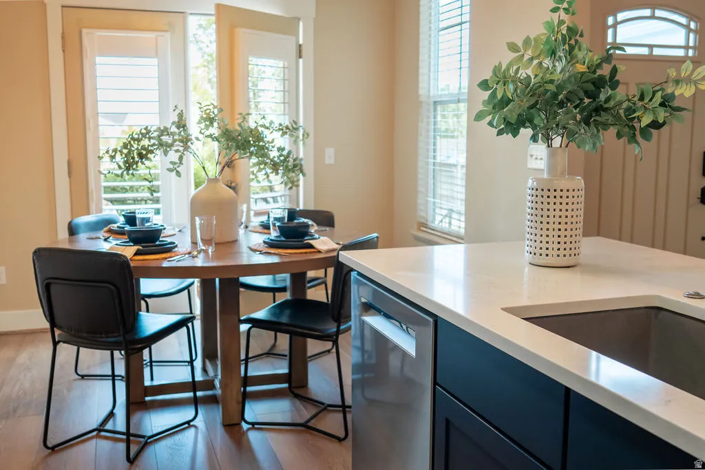 Open-concept living area with wood-finish flooring