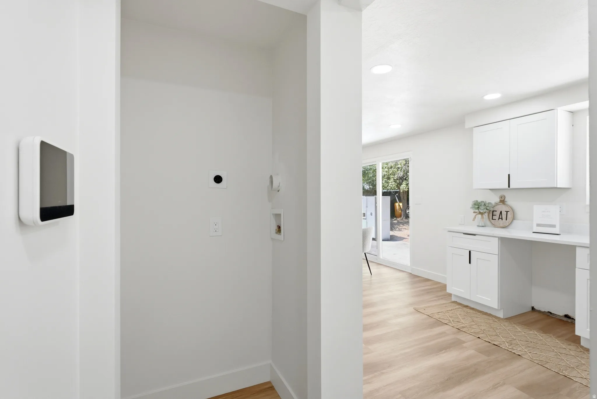 Dedicated laundry area featuring hookups and a bright, neutral color palette