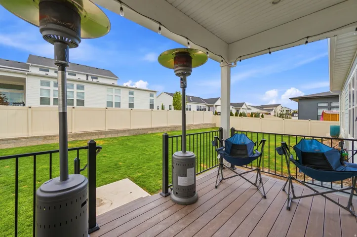 Covered outdoor deck with wood-finish flooring