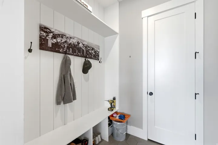 Entryway with built-in bench seating and storage cubbies