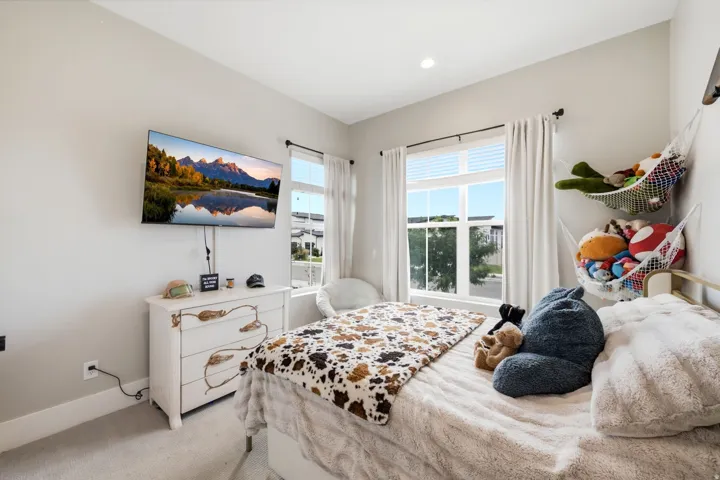 Bedroom featuring neutral wall paint, recessed lighting, and soft carpet flooring