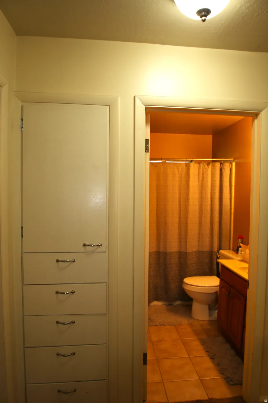 Built-in hallway cabinetry featuring six drawers and one upper cabinet