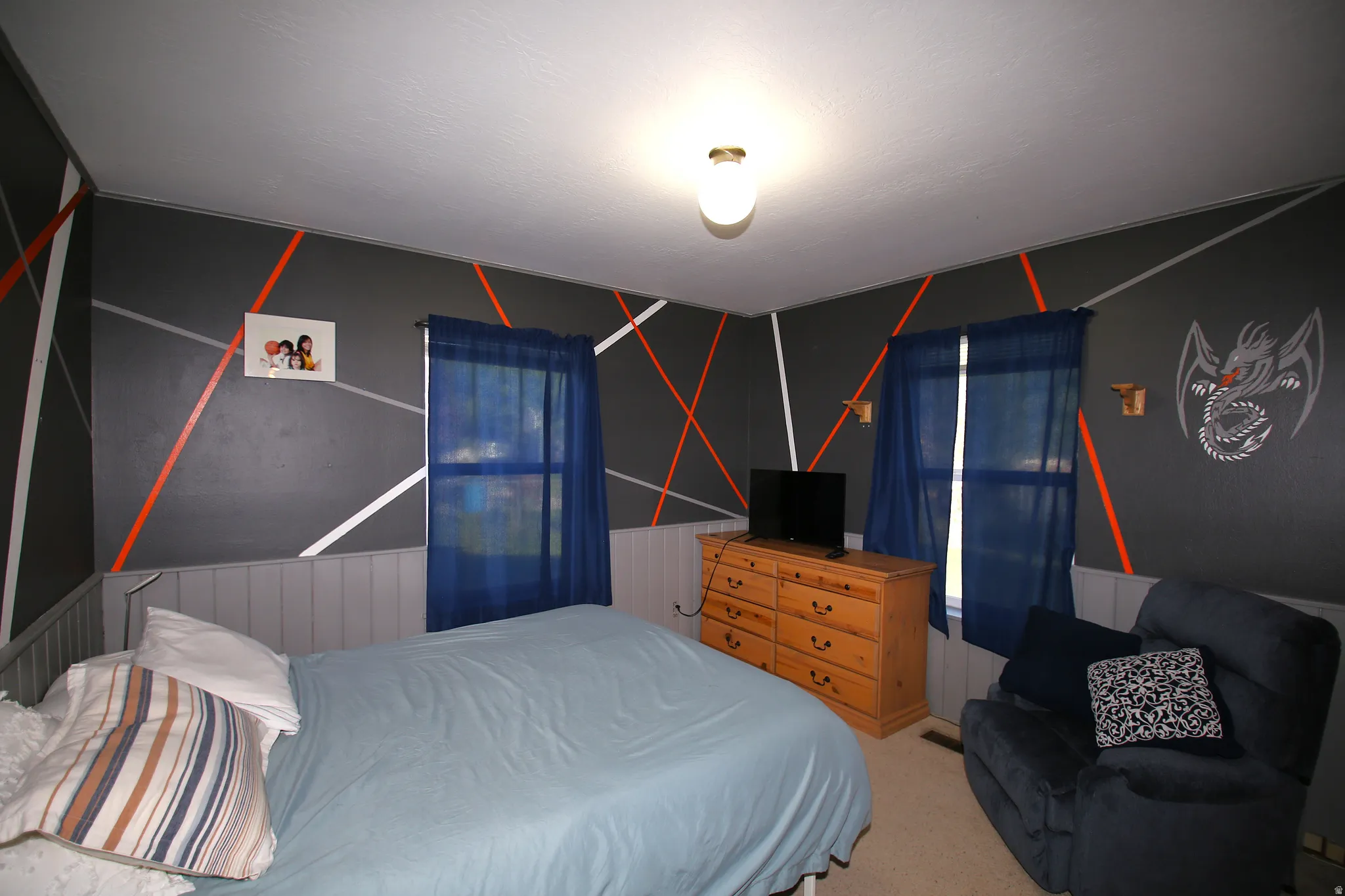 Interior room featuring textured carpeting and a ceiling-mounted light fixture