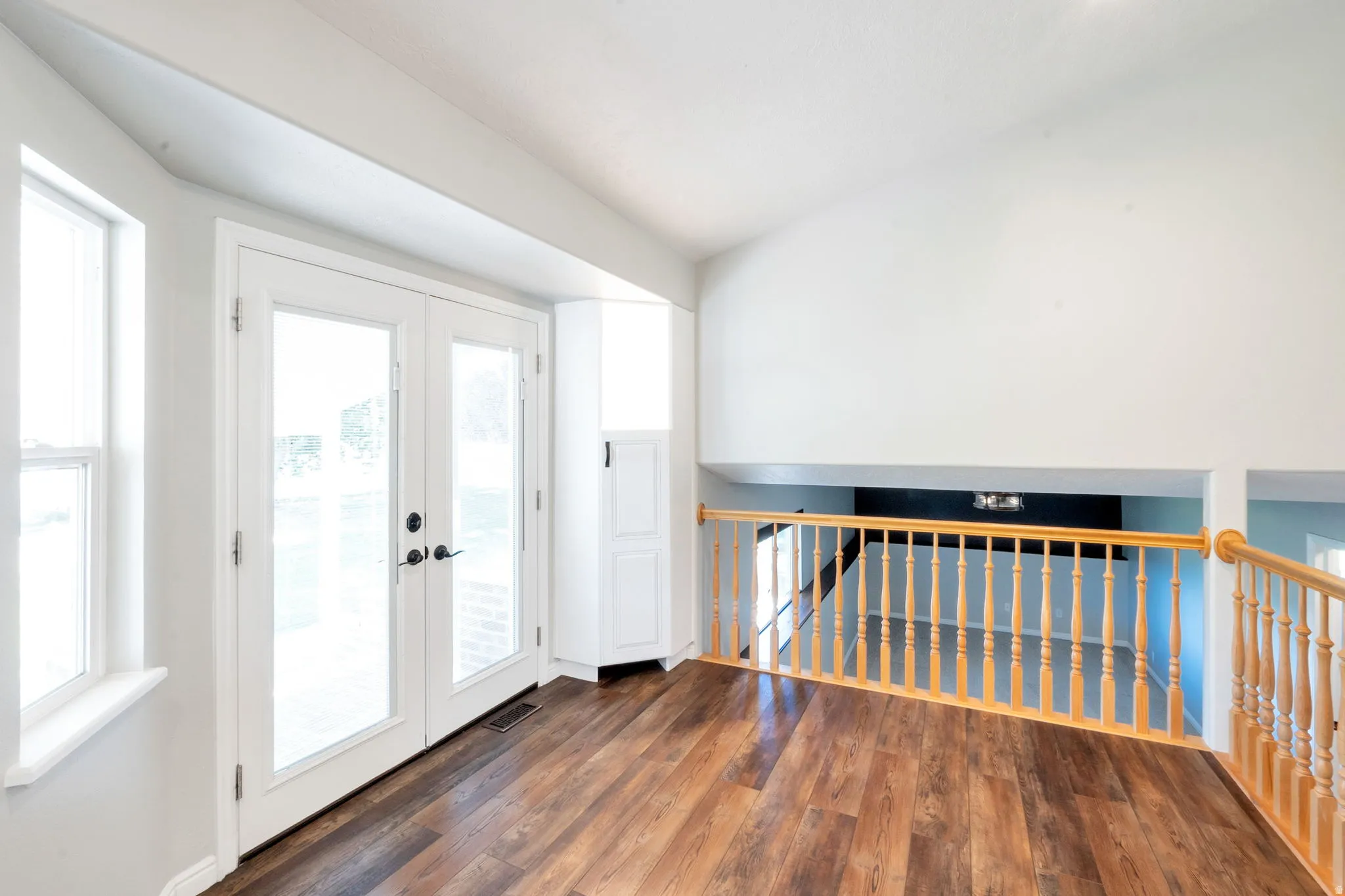 Vaulted ceiling with wood-finish flooring