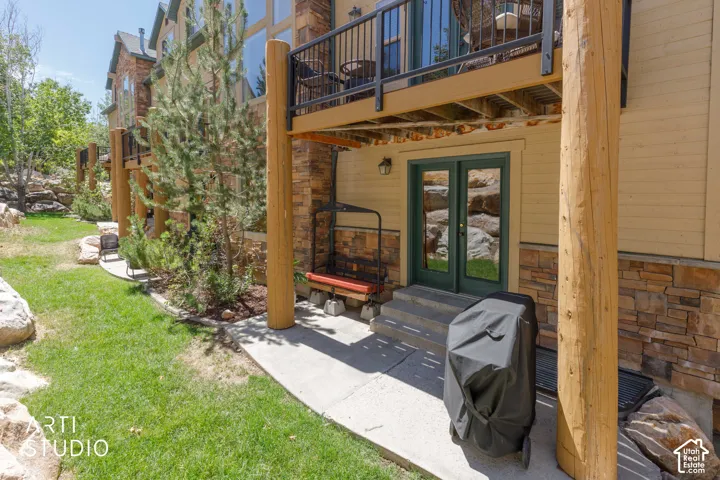 Private patio area with ski lift and Weber grill