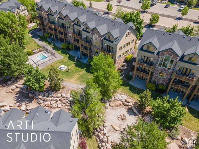 Back of building showing jacuzzi and fire pit area