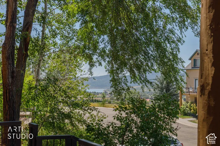 Mature trees frame  views of Pineview and snowbasin from the front porch