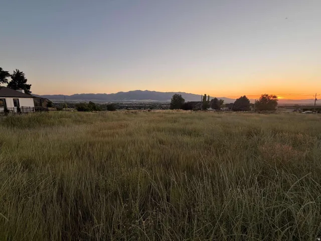 Expansive undeveloped land featuring distant mountain scenery