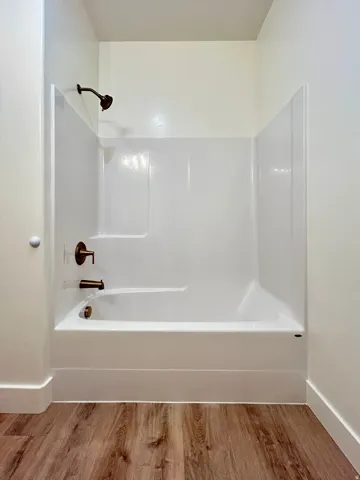 Shower and tub combination featuring bronze fixtures