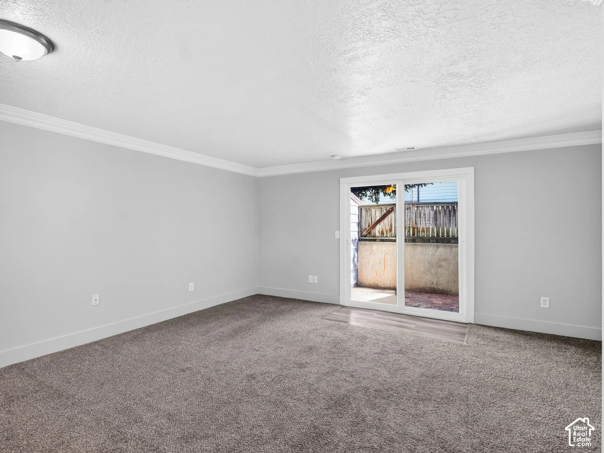 living room featuring sliding glass doors providing access to an outdoor patio space