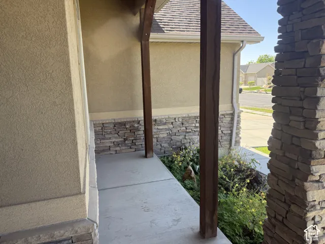 Covered porch with concrete flooring