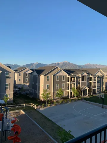 Mountain backdrop framing multi-story residential buildings