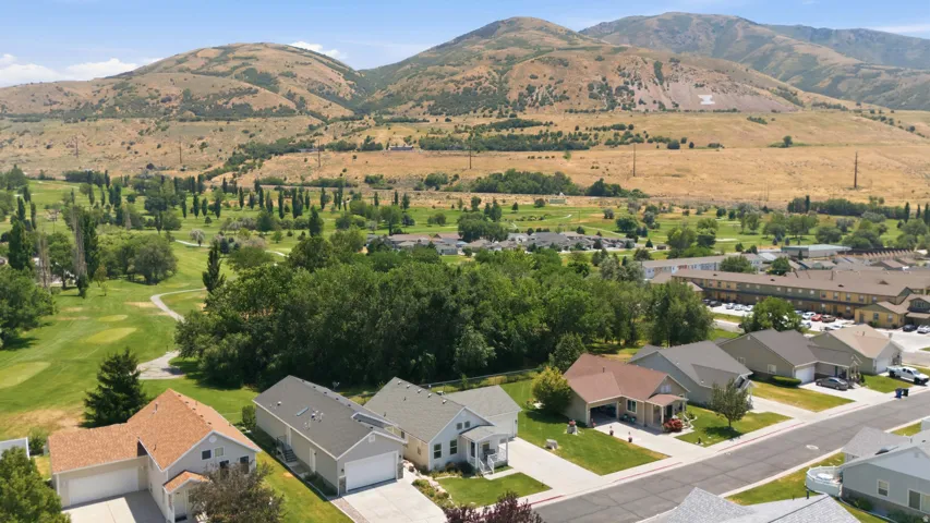 Aerial perspective showcasing residential properties with a mountainous backdrop