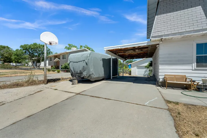 Concrete driveway with a covered carport