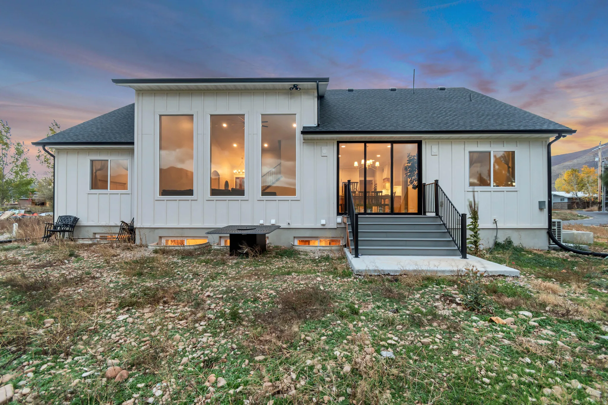 Modern exterior featuring white board and batten siding