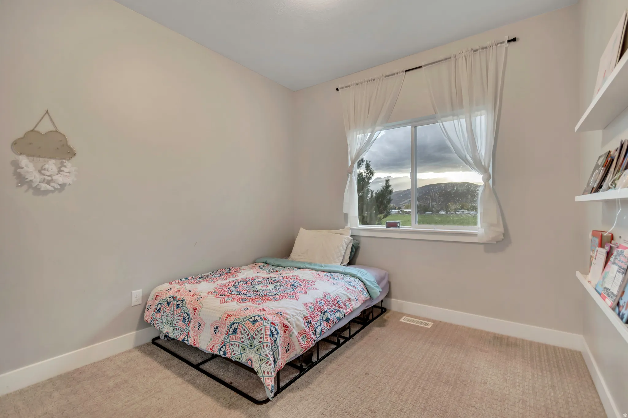 Neutral wall color complemented by white trim and carpeting