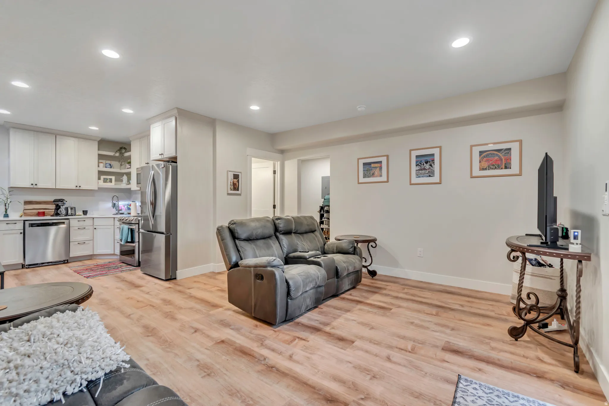 Open-concept living space featuring wood-finish flooring throughout