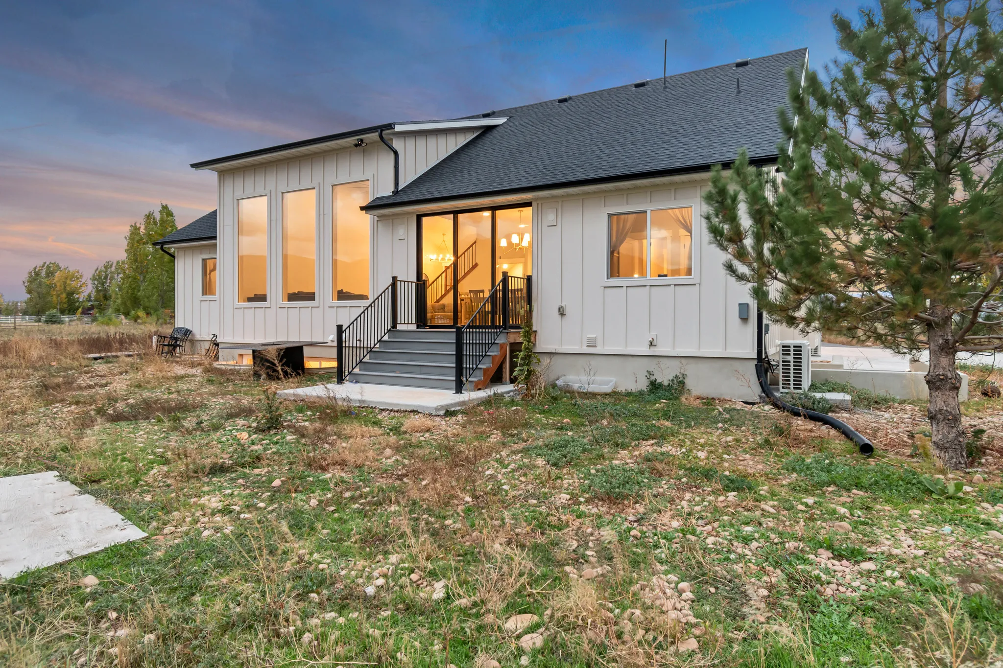 Modern architectural design featuring white board and batten siding