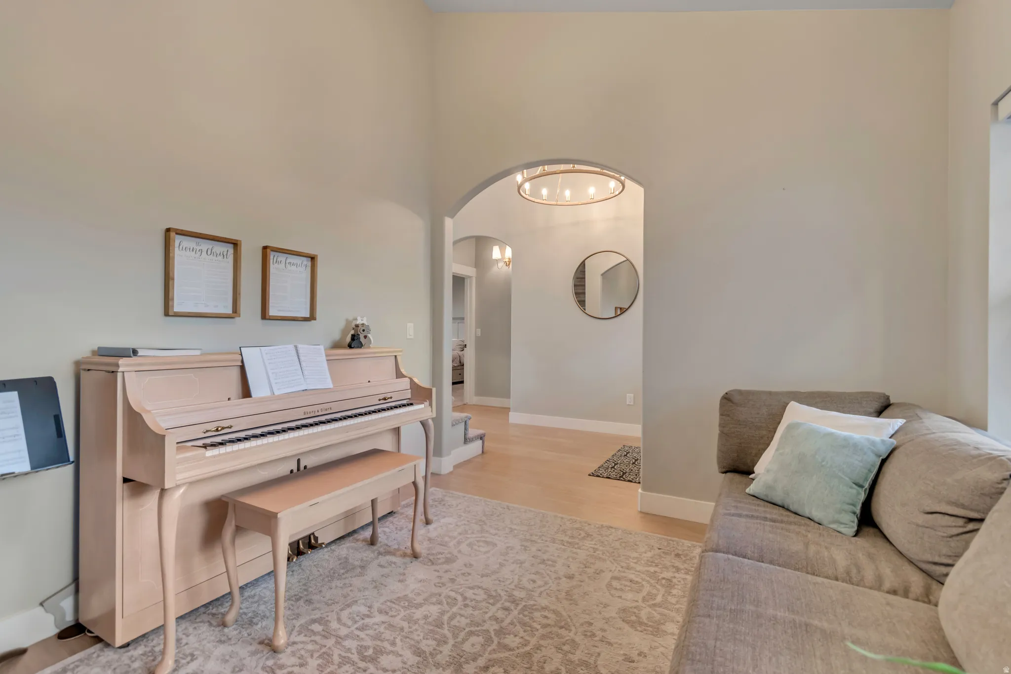 Hardwood-style flooring and light neutral wall tones create a bright interior