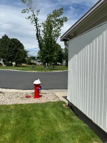 Exterior siding with brown gutters
