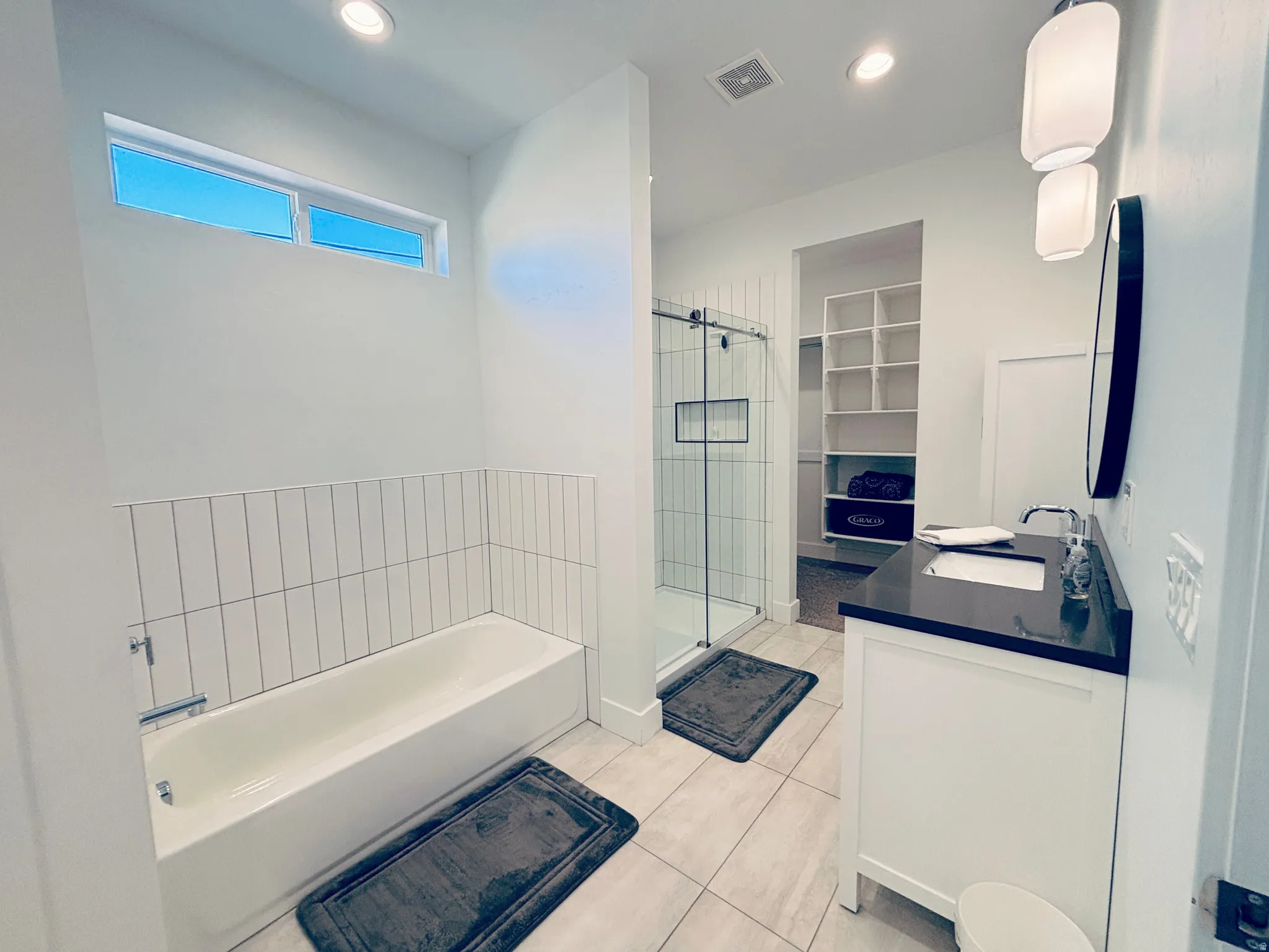 Primary bath - separate sinks, separeat, tub and shower, closed toilette room, and large walk-in closet.