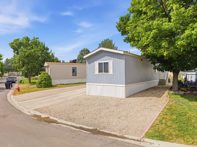 Light blue exterior with white trim and white window shutters