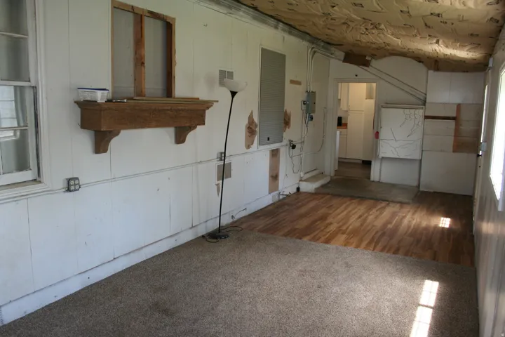 Interior space featuring wood-finish flooring and carpet