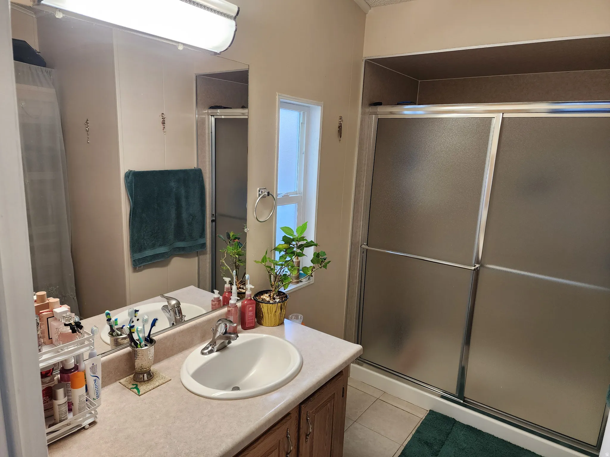 Full vanity mirror with linear overhead lighting