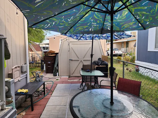 Outdoor patio area featuring a combination of paver and brick surfaces
