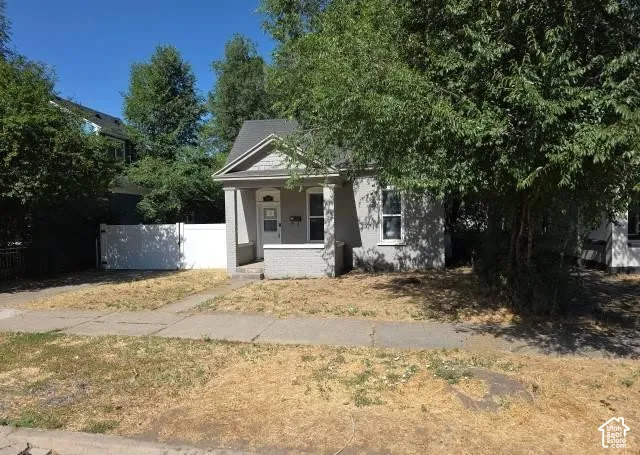 Gray exterior with white trim and a covered front porch