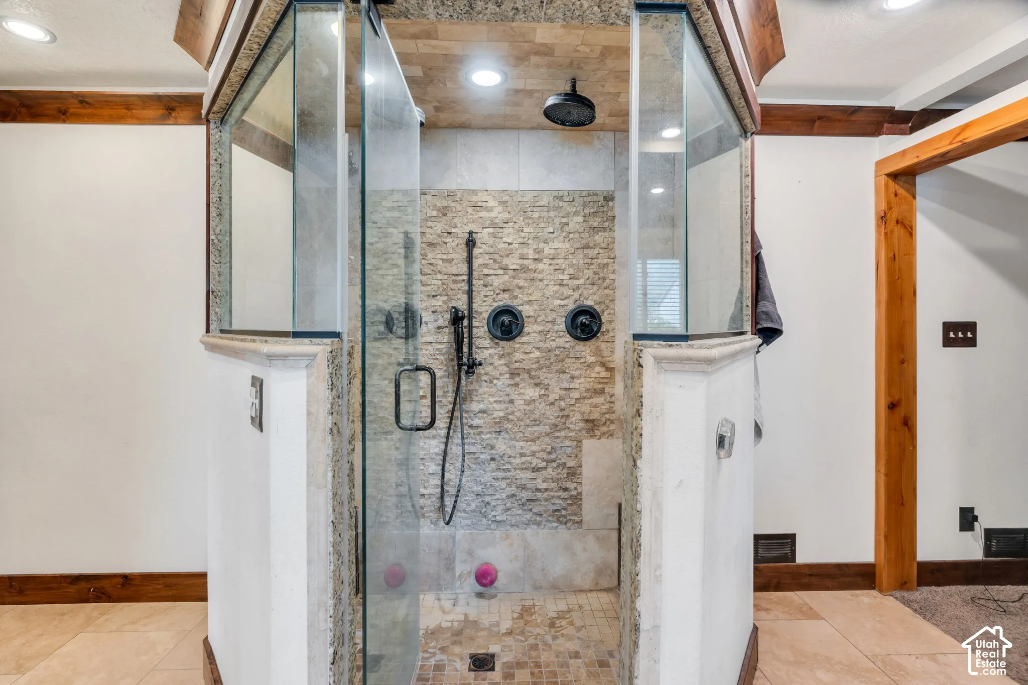 Stunning large walk in shower with custom tilework.