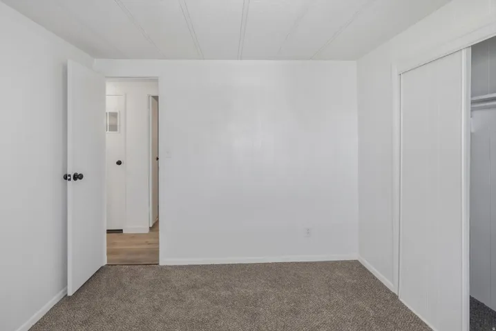Neutral-toned carpeting complements white walls and trim