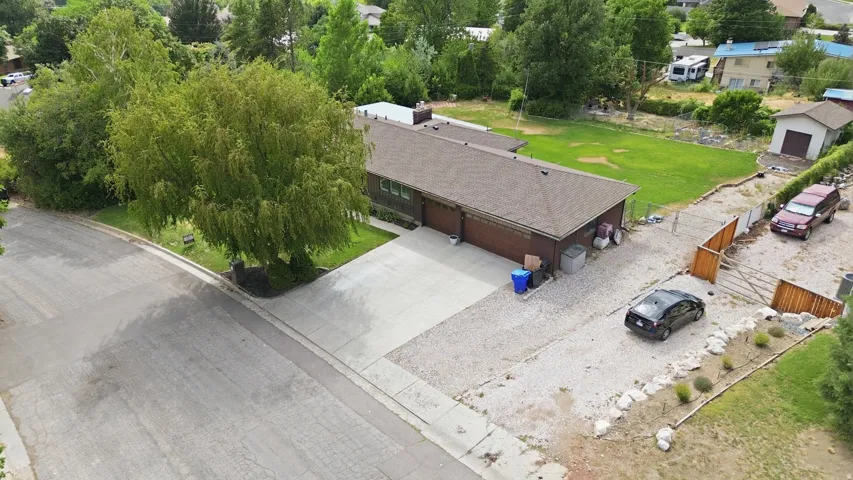 Ranch-style residence featuring a detached garage/shed structure