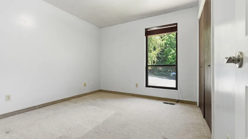 Neutral-toned carpeting throughout