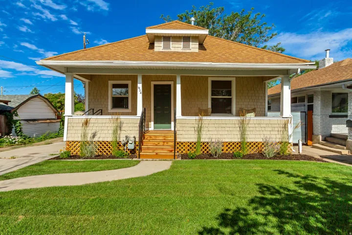 Craftsman-style facade featuring shake siding and a gabled roof