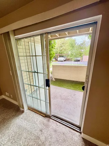 SLIDING GLASS DOORS OPENING TO THE COVERED PATIO!