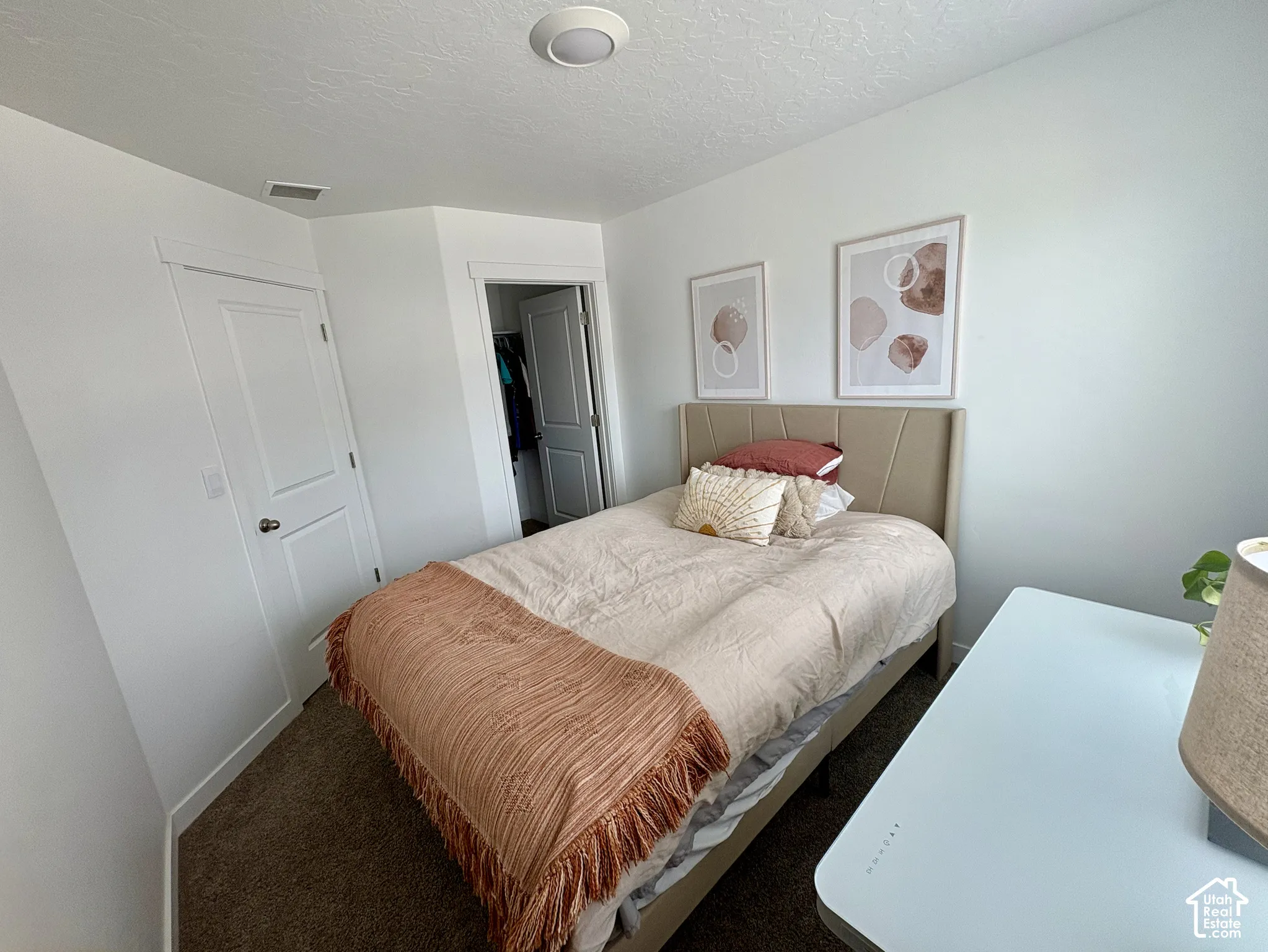 Plush carpet flooring complements crisp white walls
