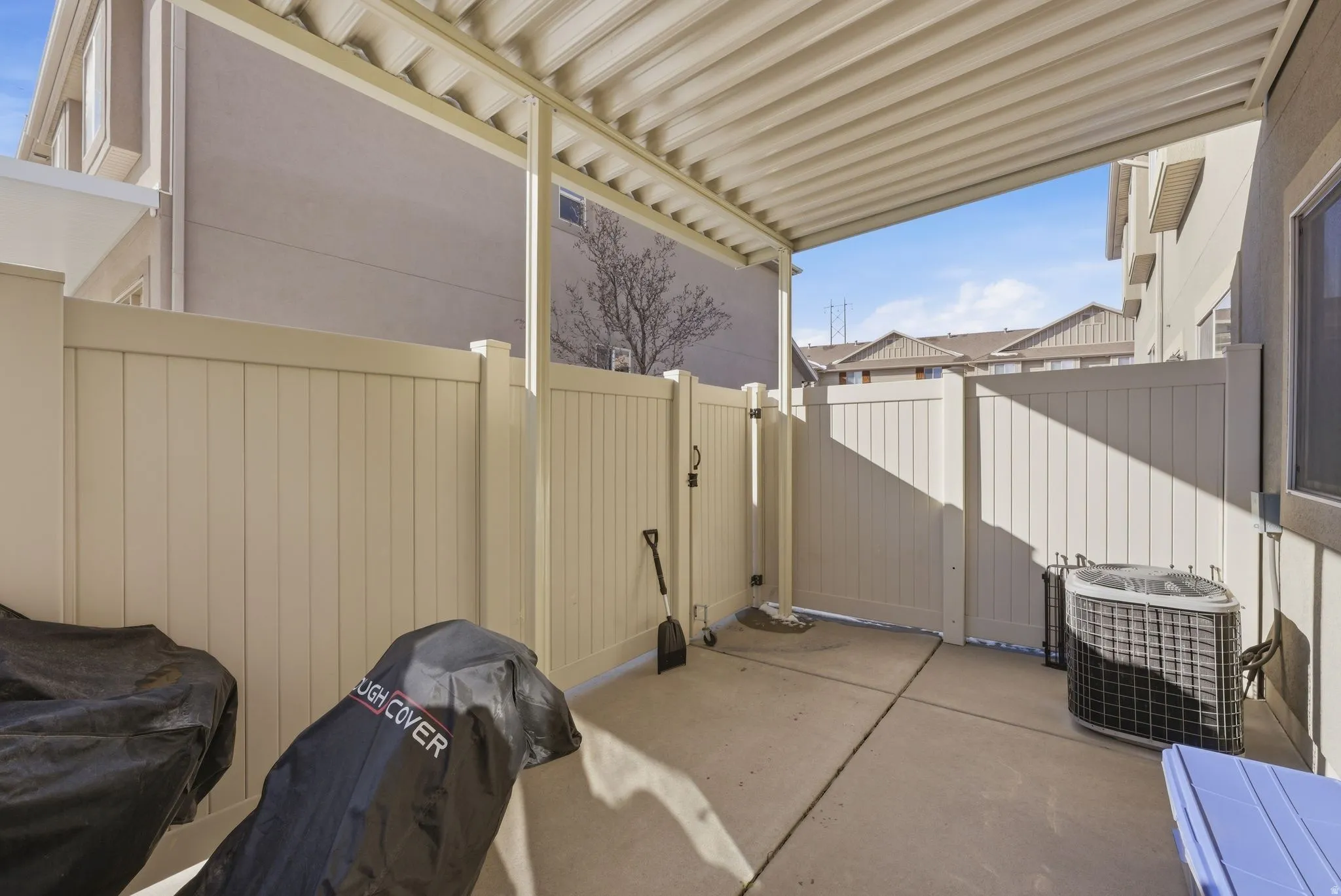 Covered patio. View of patio with a gate