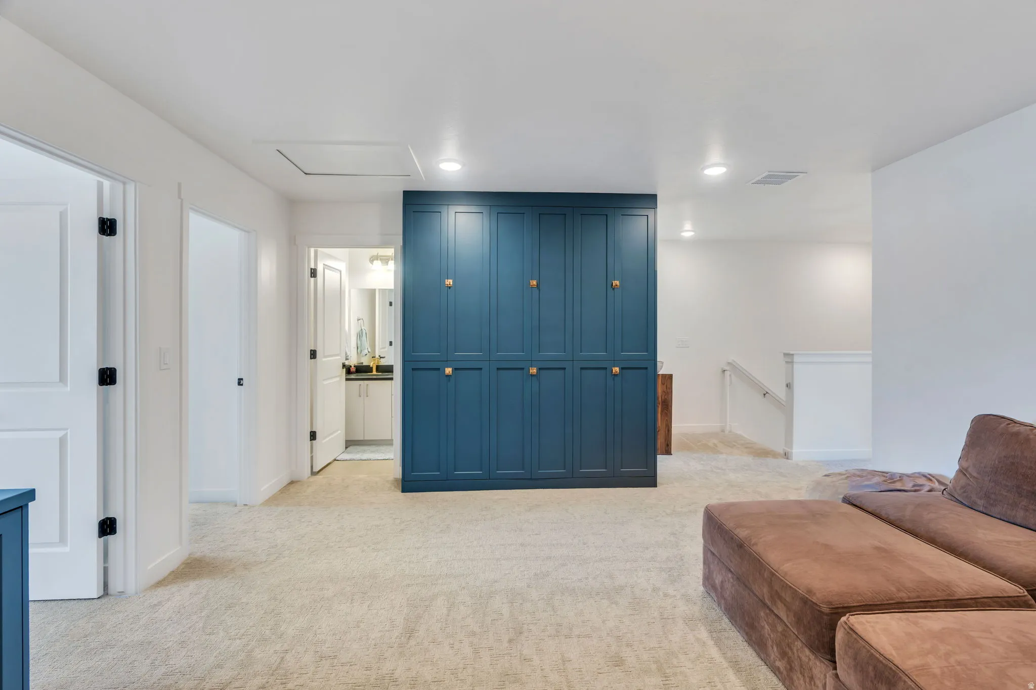 Custom built-in blue cabinetry with gold-tone hardware unique to this townhome.