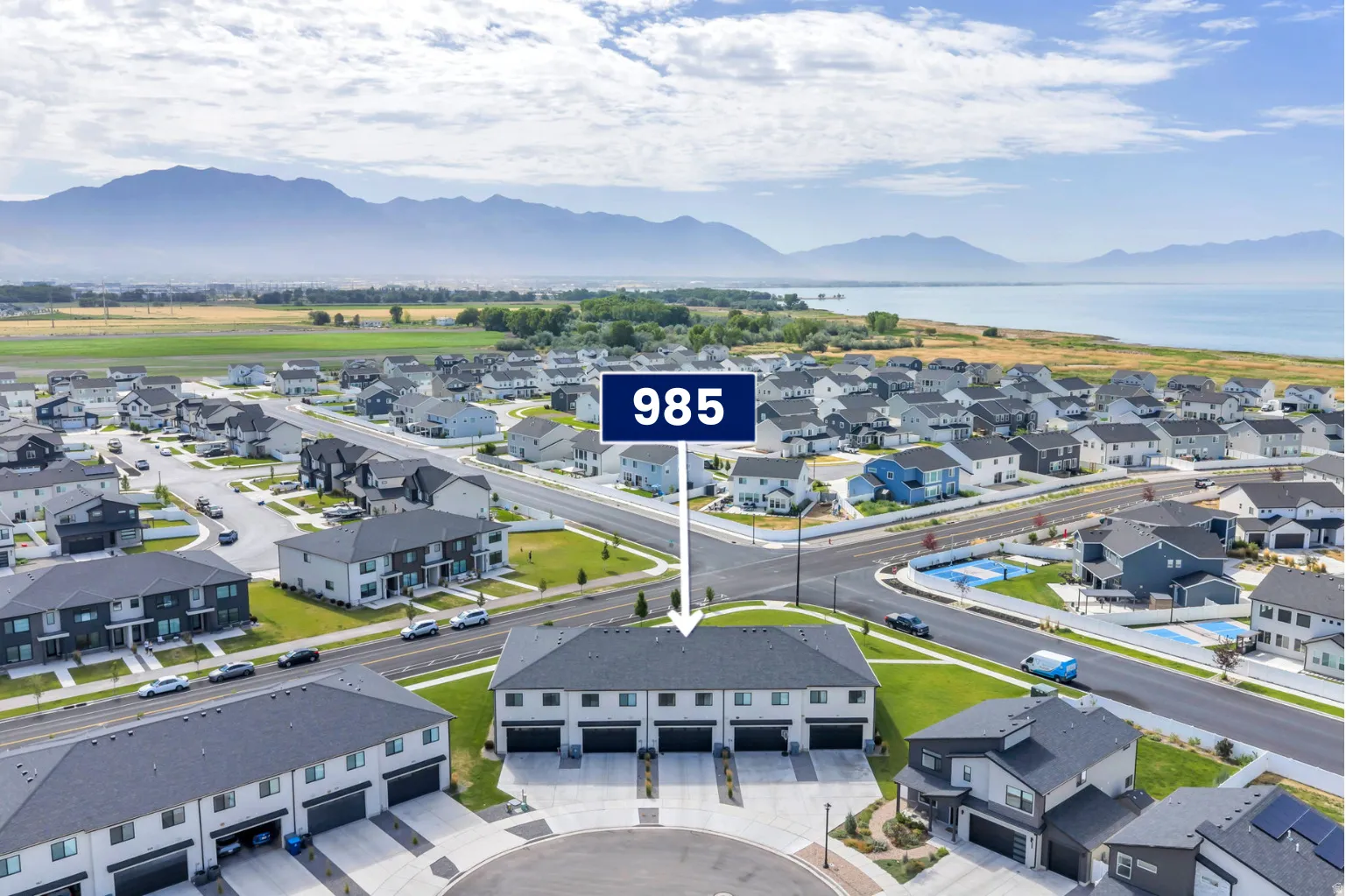 Townhome residences featuring modern architectural design and attached garages