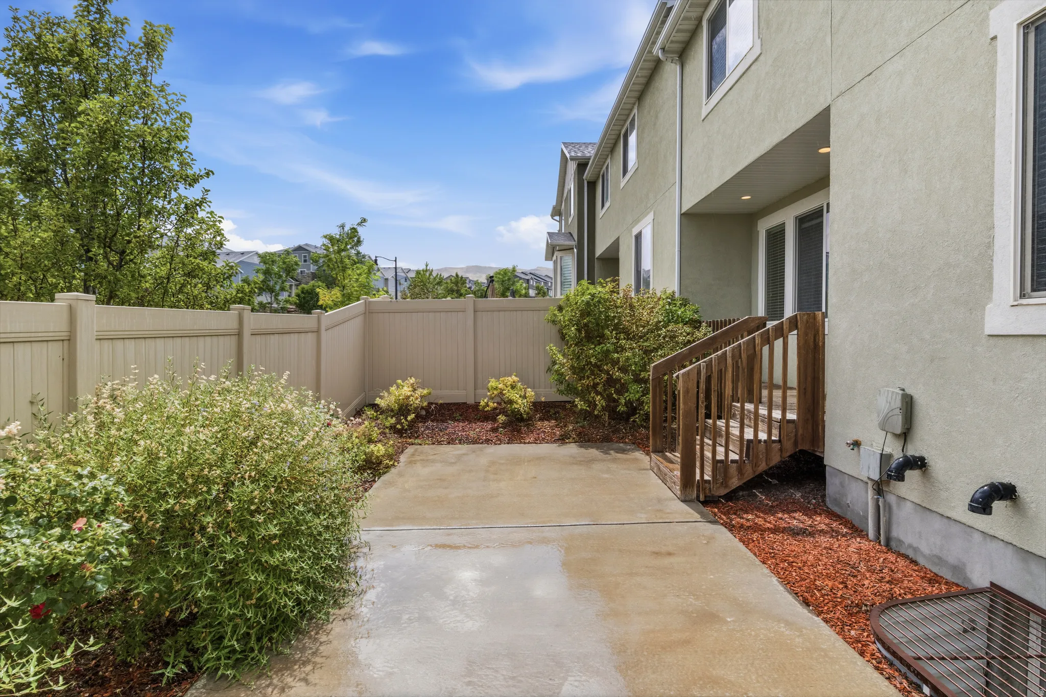 Private outdoor patio area with concrete surfacing