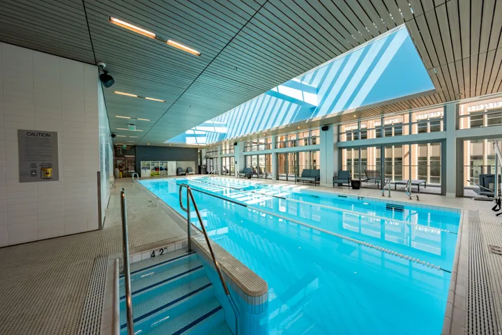 Indoor lap pool with integrated steps and handrails