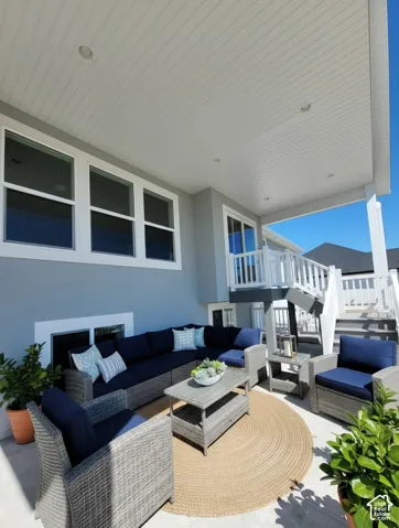 Covered patio featuring a beadboard ceiling with recessed lighting