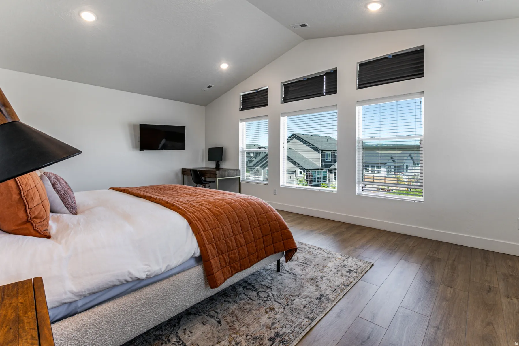 Vaulted ceiling featuring recessed lighting