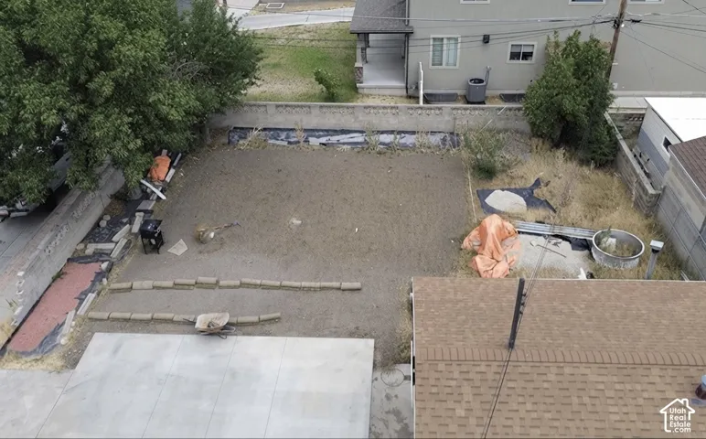 Expansive rear yard with a large concrete patio