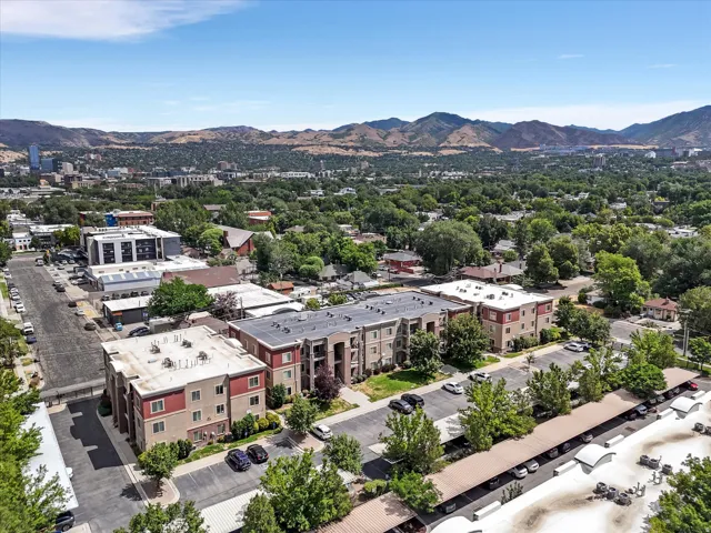 Multi-story residential buildings featuring contemporary facades and covered parking structures