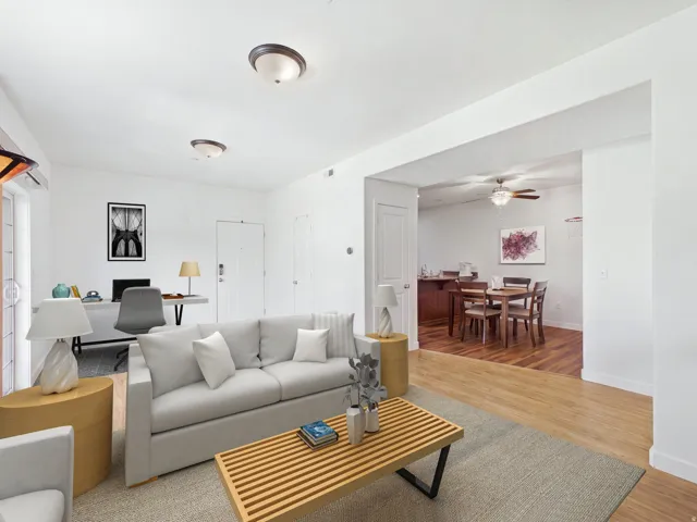 Neutral wall finishes with a light-colored carpeted area